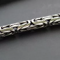 Tükörfényes széles merev katkötő