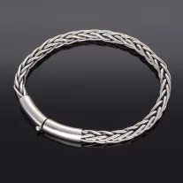   Vastag fonott ezüst karkötő nyelves záras ezüst betéttel